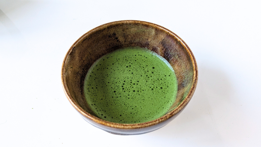 Traditional bowl of Japanese matcha representing its historical connection to health, wellbeing, and tea culture.