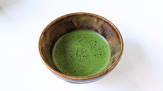 Traditional bowl of Japanese matcha representing its historical connection to health, wellbeing, and tea culture.