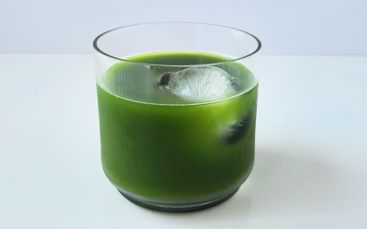 Vibrant green ceremonial grade matcha powder in bowl showing freshness and quality
